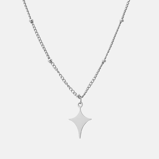 Silver star-shaped pendant necklace on a white background
